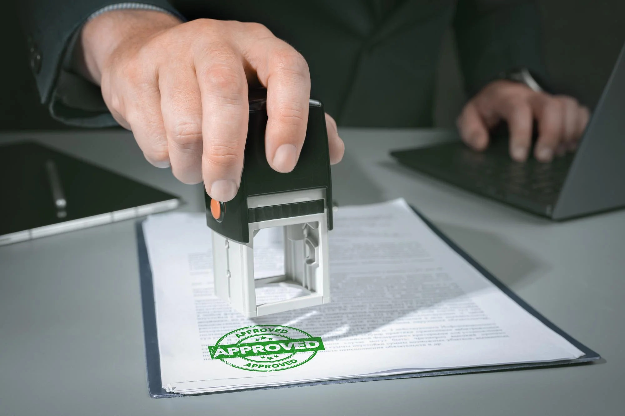 hands-businessman-stamp-paper-document-approve-business-investment-contract-agreement-closeup-person-hand-stamping-with-approved-stamp-document-desk_11zon